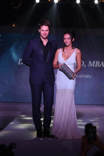 Journalist Daniela Laurel alongside French actor Lucas Bravo.